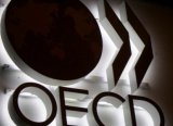 OECD küresel büyüme öngörüsünü düşürdü